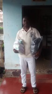 Mr. Atembeshu Julius, SAGAC SG receiving donation from MAOH